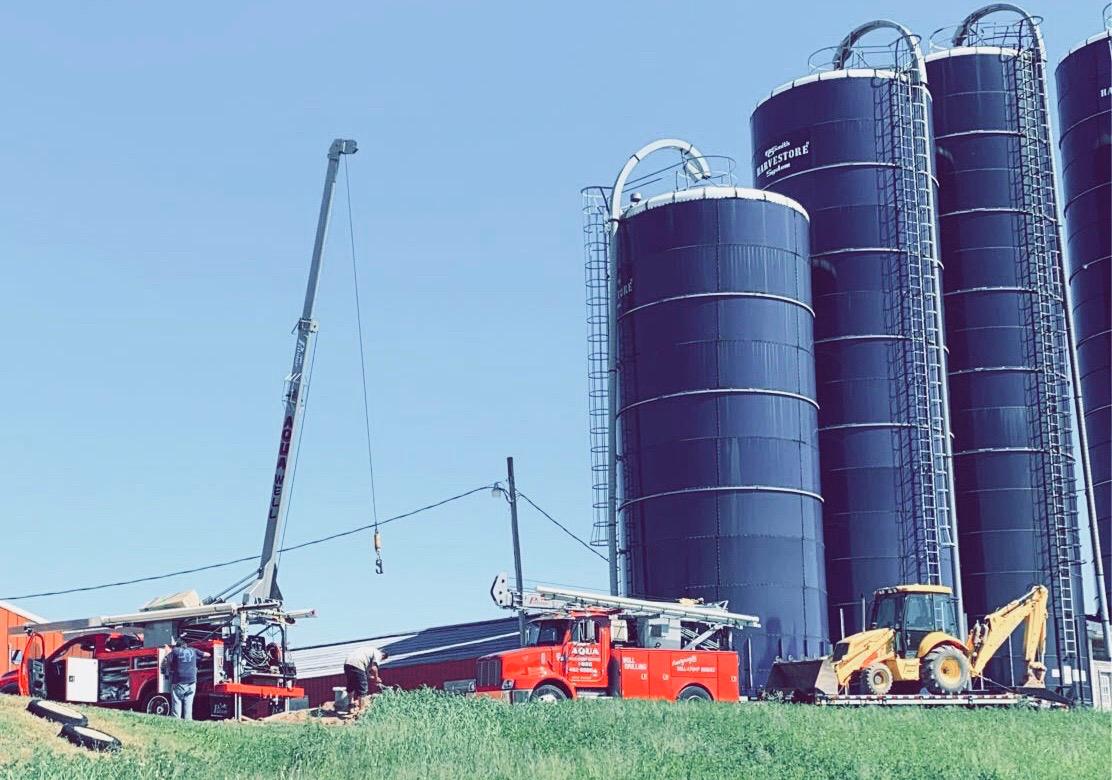 Aqua well drilling truck working at a Wisconsin farm