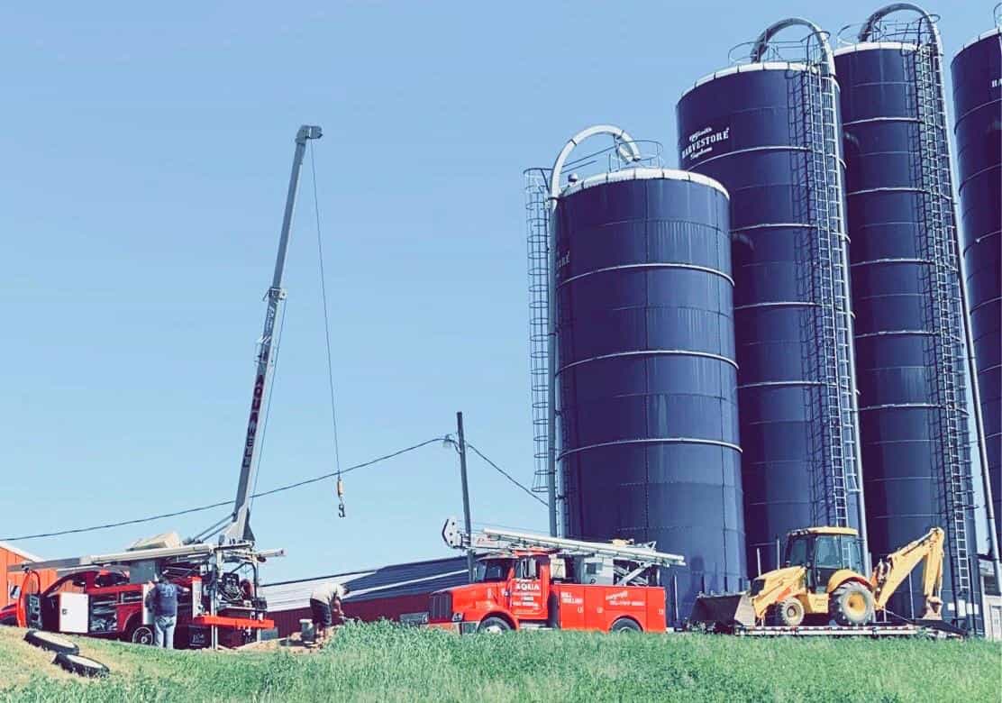 Aqua Well and Pump service trucks at a Wisconsin farm